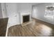 Living room with hardwood floors, fireplace and front door view at 4438 Cochran Farm Ln, Charlotte, NC 28269