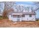 Modest one-story home with screened porch and large front yard at 523 Dellwood Dr, Huntersville, NC 28078