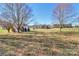 Spacious backyard with a detached building and fenced area at 523 Fort Dobbs Rd, Statesville, NC 28625