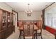 Formal dining room with chandelier, large table, and classic decor at 523 Fort Dobbs Rd, Statesville, NC 28625