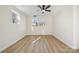 Well-lit bedroom with vinyl flooring and ceiling fan at 607 King Arthur Dr, Gastonia, NC 28056