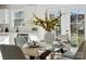 Elegant dining room with glass table and modern chairs, near the kitchen at 607 King Arthur Dr, Gastonia, NC 28056