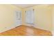 Bedroom with hardwood floors and neutral walls and a closet at 6426 Montpelier Rd, Charlotte, NC 28210