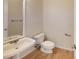 Simple half bathroom with pedestal sink and toilet at 7031 Walton Heath Ln, Charlotte, NC 28277