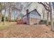 House's rear view, showcasing the backyard and deck at 9611 Hanover Ridge Ct, Charlotte, NC 28210