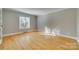 Spacious bedroom with hardwood floors and window at 9611 Hanover Ridge Ct, Charlotte, NC 28210