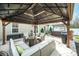 Covered patio with outdoor furniture, grill, and hot tub at 9706 Crooms Ct, Charlotte, NC 28215