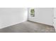 Simple bedroom with gray carpet and a window at 1009 20Th Avenue Se Loop, Hickory, NC 28602