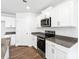 Modern kitchen with white cabinets, granite countertops, and stainless steel appliances at 1009 20Th Avenue Se Loop, Hickory, NC 28602