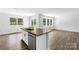 Eat-in kitchen with island, hardwood floors, and access to backyard at 1009 20Th Avenue Se Loop, Hickory, NC 28602