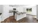 Modern kitchen with island, stainless steel appliances, and dark hardwood floors at 1009 20Th Avenue Se Loop, Hickory, NC 28602