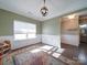 Dining room with hardwood floors, wainscoting, and access to bathroom at 125 Sierra Chase Dr, Statesville, NC 28677