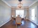 Bright dining room with hardwood floors and chandelier at 125 Sierra Chase Dr, Statesville, NC 28677