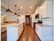 Open kitchen with white cabinets and stainless steel appliances at 125 Sierra Chase Dr, Statesville, NC 28677