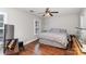 Spacious bedroom with wood floors, large bed, and a fish tank at 127 Morning Mist Ln # D, Mooresville, NC 28117