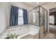 Relaxing bathroom featuring a soaking tub and shower at 1345 Shimmer Light Cir, Rock Hill, SC 29732