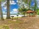 Wooden gazebo with picnic tables and grills overlooking the lake at 1345 Shimmer Light Cir, Rock Hill, SC 29732