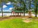 Lakeside recreational area with gazebo, picnic tables, and swing at 1345 Shimmer Light Cir, Rock Hill, SC 29732