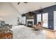 Living room with vaulted ceilings, a fireplace, large windows, and comfortable seating at 1345 Shimmer Light Cir, Rock Hill, SC 29732