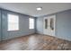 Spacious bedroom with wood-look floors and mirrored closet doors at 2124 Mcbrayer Springs Rd, Shelby, NC 28150