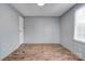 Simple bedroom with wood-look floors and gray walls at 2124 Mcbrayer Springs Rd, Shelby, NC 28150