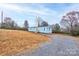 Cute light blue mobile home on a gravel driveway at 2124 Mcbrayer Springs Rd, Shelby, NC 28150
