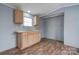 Small kitchen with light wood cabinets and vinyl flooring at 2124 Mcbrayer Springs Rd, Shelby, NC 28150