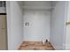 Functional laundry room with wire shelving and vinyl flooring at 2124 Mcbrayer Springs Rd, Shelby, NC 28150