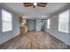 Open living area with wood-look floors, gray walls, and kitchen at 2124 Mcbrayer Springs Rd, Shelby, NC 28150