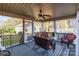 Cozy screened porch featuring wicker seating and a ceiling fan at 2676 Pineview Dr, Lancaster, SC 29720