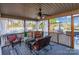 Relaxing screened porch with wicker furniture, ceiling fan, and view of the backyard at 2676 Pineview Dr, Lancaster, SC 29720