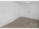 Simple bedroom with white walls and neutral carpeting at 304 Gold Hill Ave, Rockwell, NC 28138