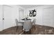 Dining area with round table, modern chairs and wood floors at 304 Gold Hill Ave, Rockwell, NC 28138