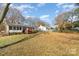 Spacious backyard with mature trees and two houses at 327 Woodside Dr, Shelby, NC 28150