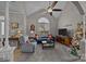 Living room features vaulted ceiling, fireplace, and large window at 3528 Briarthorne Dr, Charlotte, NC 28269