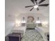 Cozy bedroom with twin beds, ceiling fan, and hardwood floors at 3703 Old Pageland Marshville Rd, Wingate, NC 28174