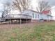 Home's exterior showcasing deck and landscaping at 3703 Old Pageland Marshville Rd, Wingate, NC 28174