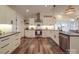 Modern white kitchen with ample cabinetry, stainless steel appliances, and hardwood floors at 3703 Old Pageland Marshville Rd, Wingate, NC 28174