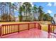 View from a back deck showing a large fenced backyard and trees at 417 Stowe Rd, Belmont, NC 28012