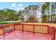 Spacious back deck overlooks a fenced-in backyard with mature trees at 417 Stowe Rd, Belmont, NC 28012