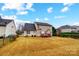 Large backyard with a wooden deck and a grassy lawn at 417 Stowe Rd, Belmont, NC 28012