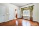 Bedroom with hardwood floors and a view of the backyard at 417 Stowe Rd, Belmont, NC 28012