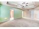 Bright bedroom with light green walls and ceiling fan at 417 Stowe Rd, Belmont, NC 28012