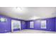 Purple bedroom with two windows, carpet, and simple decor at 417 Stowe Rd, Belmont, NC 28012