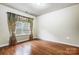 Bedroom with hardwood floors and window with curtains at 417 Stowe Rd, Belmont, NC 28012