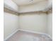 Walk-in closet with wire shelving and neutral carpet at 417 Stowe Rd, Belmont, NC 28012