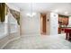 Bright dining area with tile floor and kitchen access at 417 Stowe Rd, Belmont, NC 28012