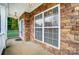 Inviting front porch with stone facade and landscaping at 417 Stowe Rd, Belmont, NC 28012