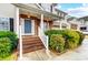 Two-story home with brick steps and charming landscaping at 417 Stowe Rd, Belmont, NC 28012