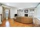 Spacious living room with hardwood floors and a sectional sofa at 417 Stowe Rd, Belmont, NC 28012